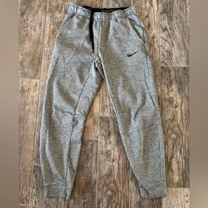 Nike Therma-FIT Tapered Training Pants in a heather gray size Medium